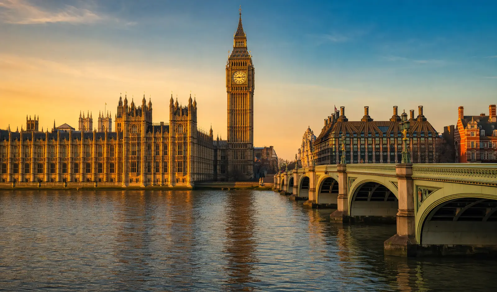 The river Thames and the Houses of Parliament with the clock tower at golden hour